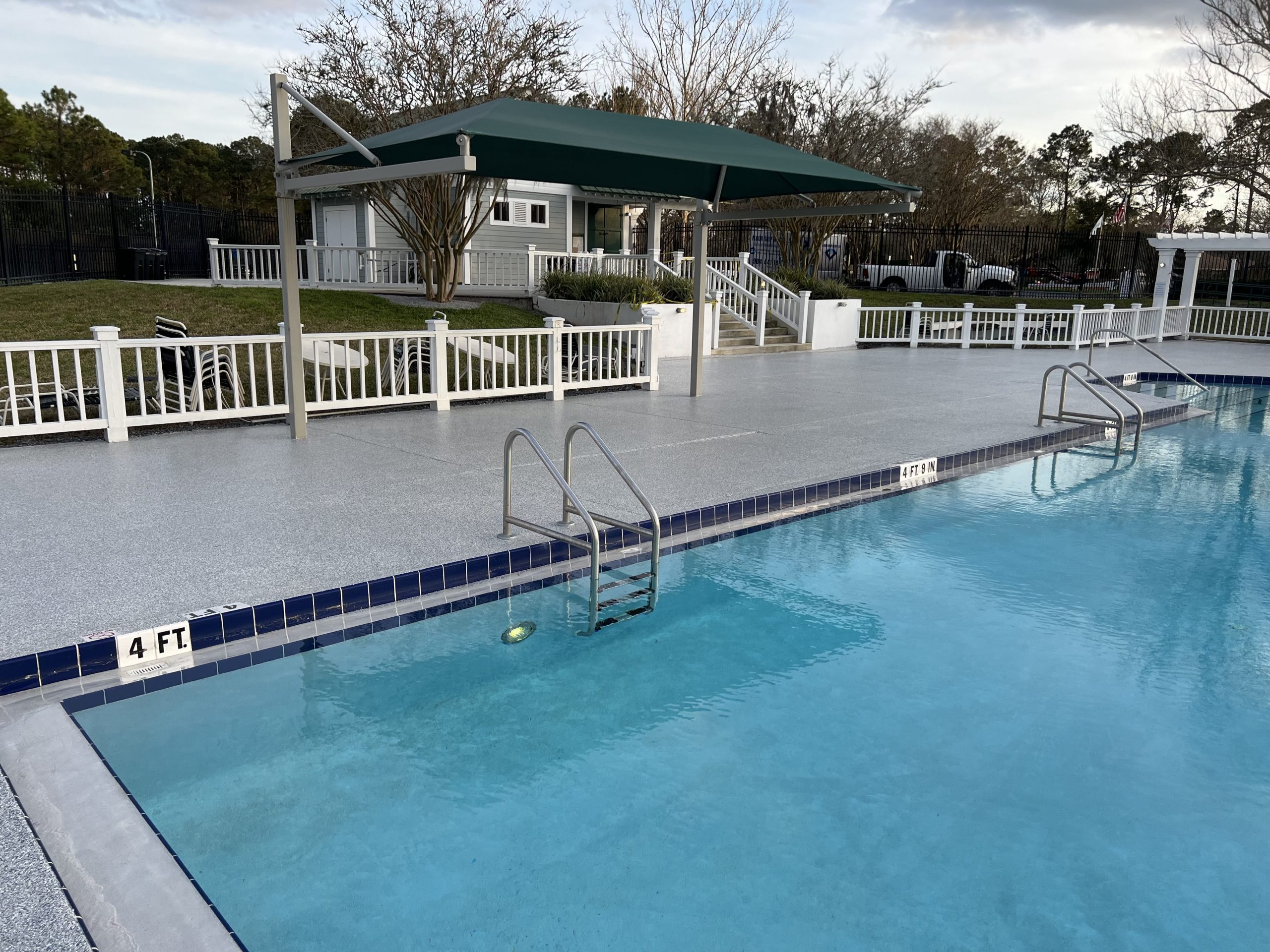 Commercial HOA pool deck coating by Floor Grip Medic